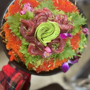 a person holding a plate of food