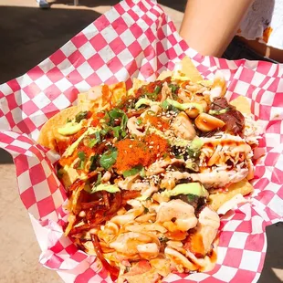 Poke Nachos with Spicy Ahi, Limu Ahi Masago Poke, Imitation Crab, Taegu, Pickled Garlic, Unagi Sauce, Wasabi and Masago
