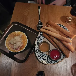 a plate of food and a glass of wine