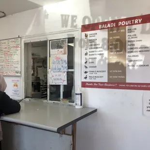 a woman standing at a counter