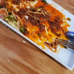 They should call this dish &apos;Oil with Spaghetti&apos; not spaghetti with meat sauce. This restaurant will send you to the hospital. 100!