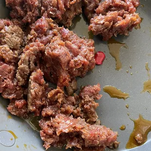 meat in a frying pan