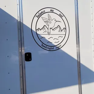 a logo on the side of a truck