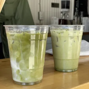 two cups of green tea on a counter