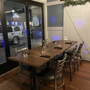 Main dining room feature table near the street windows! Super cozy. Right next to the bar.