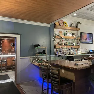 Main room bar, entrance to second dining room and bar.