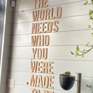 a sign that says the world needs who you were made to be