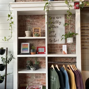 a display of clothes and plants