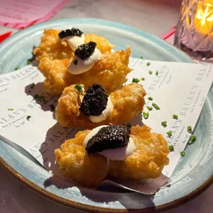 Caviar and cream fraiche atop fried chicken