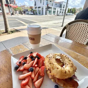 Bagel Sandwich on onion bagel (I kept the tomato &amp; spinach off)! Delicious, &amp; with Side of berries!