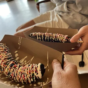 Banana dipped in dark chocolate with half sprinkles, half crushed Oreos and marshmallow drizzle.
