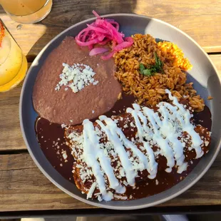 The enmoladas. Note the crema on top.