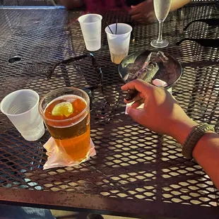 a person holding a glass of beer