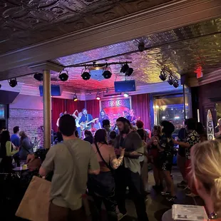 Minimal seats available a lot of people dancing &amp; moving to music.