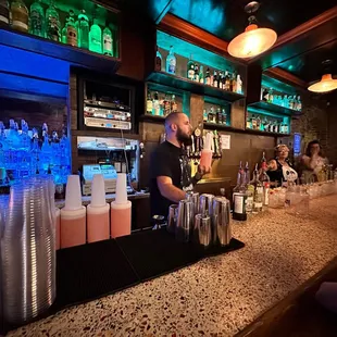 a bartender at the bar
