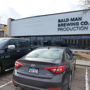 two cars parked in a parking lot