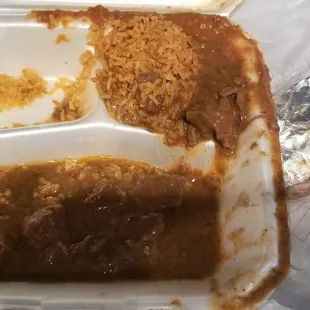 a half eaten meal in a styrofoam container