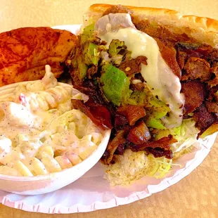 Pepper Steak sub with pasta salad and a pepperoni roll