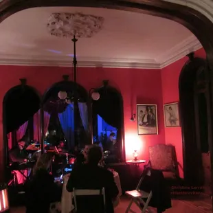 Deep hues of pink and blue drape the first floor at a recent event, as the band played on.