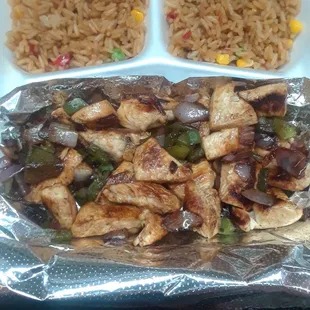 Chicken tips with fried rice.