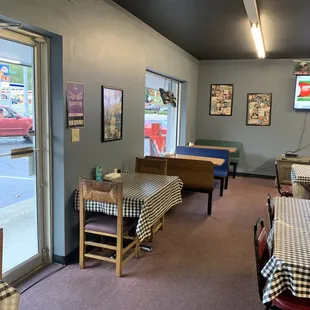 a dining area with tables and chairs