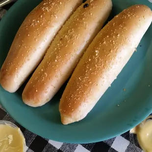 Breadsticks brushed with garlic butter and sprinkled with parmesean cheese