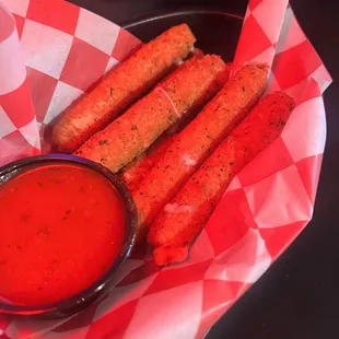 a basket of fries and dipping sauce
