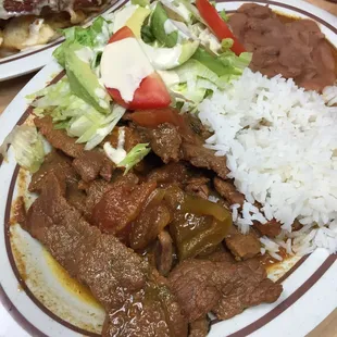 a plate of beef and rice