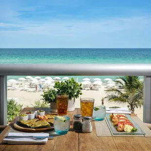 a view of the beach from a balcony