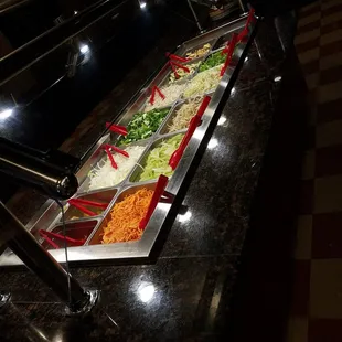 a buffet with a variety of food items