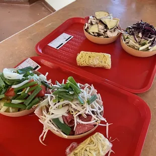 two trays of food on a table