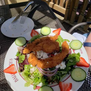 Crunchy Chicken Salad Breaded fried chicken tenderloins, strawberries, blueberries, pecans, cucumbers, red onions, and feta cheese