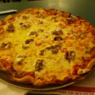 Skimpy unevenly placed sausage and cut funny, what's with the one inch slice on the right side. 4 left slices have 2 sausages