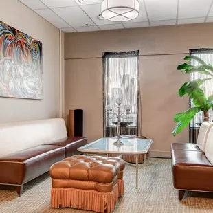 a living room with leather furniture