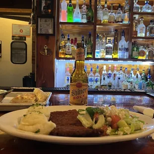 a plate of food on a bar