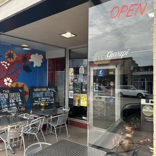 Outside. Open sign lit up