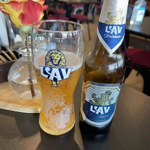 a beer and a glass on a table