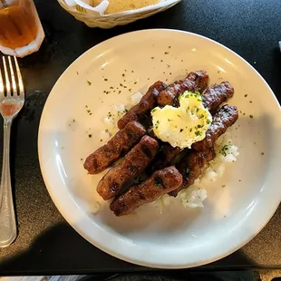 Serbian sausages with onions