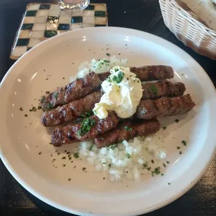 A new Balkan Serbian sausage dish called Cevapcici with Kaymak