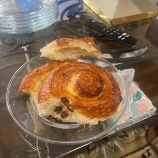 a croissant on a glass plate