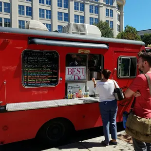people ordering food from a food truck