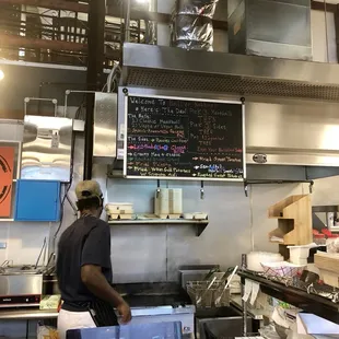 a man working in a restaurant kitchen