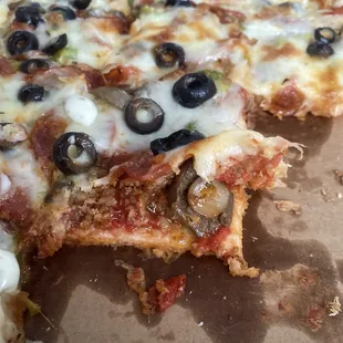 Even toppings are crammed under the other toppings &amp; cheese!