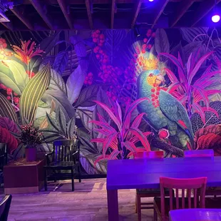 a brightly lit tropical mural