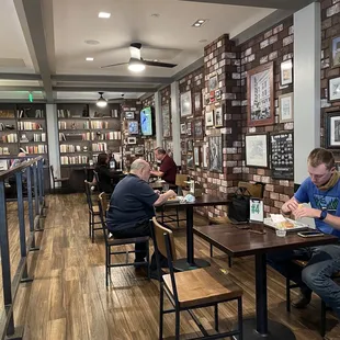 people sitting at tables eating