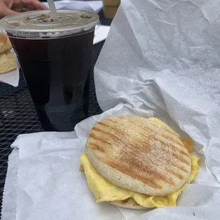 Cold brew and egg cheese on an English muffin