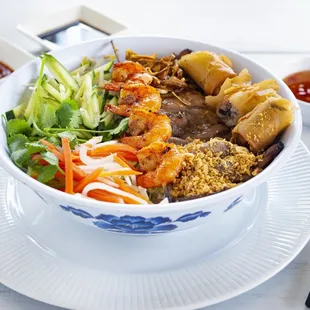 vermicelli with grilled pork, shrimp and egg roll.