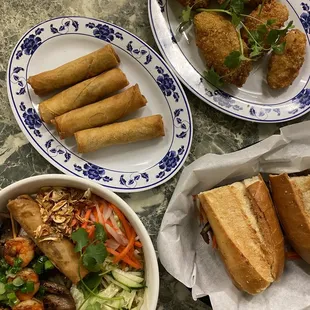 Bún (vermicelli bowl), egg rolls, chicken wings, pork banh mi