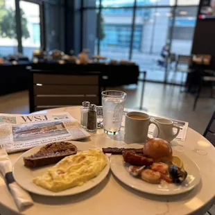 Custom gruyere and cheddar avocado omelette, French toast, prawns, mussels, local oysters, millionaires spice bacon and homemade rolls