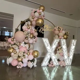 Here is what we offer with lighted marquee letters or numbers. Custom signs and florals in balloons!  Balloon it!